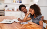 Woman helping her stressed daughter